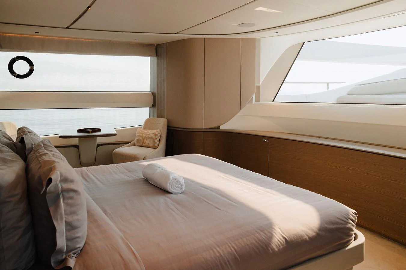 The stateroom features a luxurious bed with soft linens and ample natural light from large windows. aboard PRINCESS X95 808 Yacht for Sale