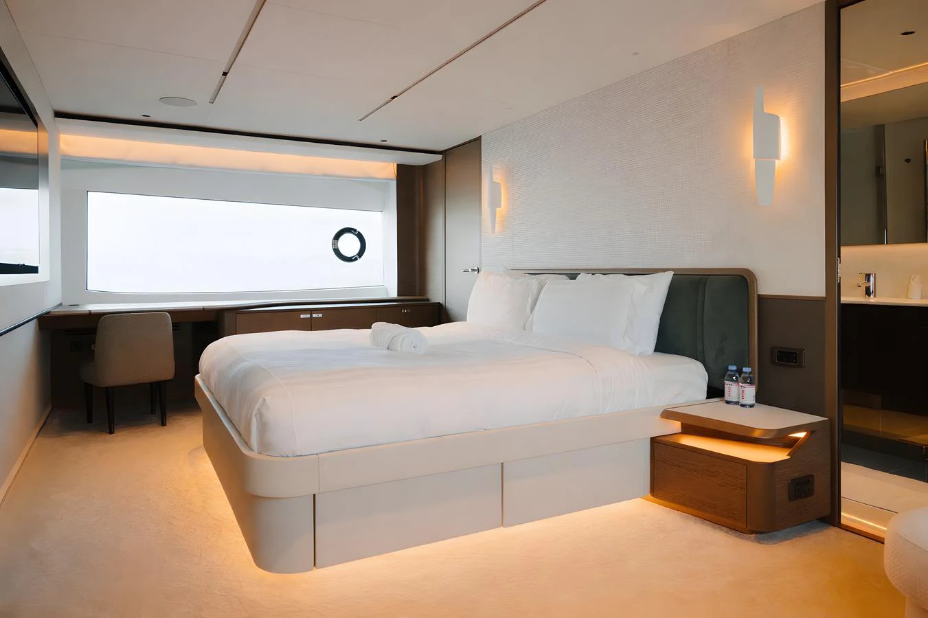 The stateroom features a luxurious bed with modern lighting and a serene ambiance. aboard PRINCESS X95 808 Yacht for Sale