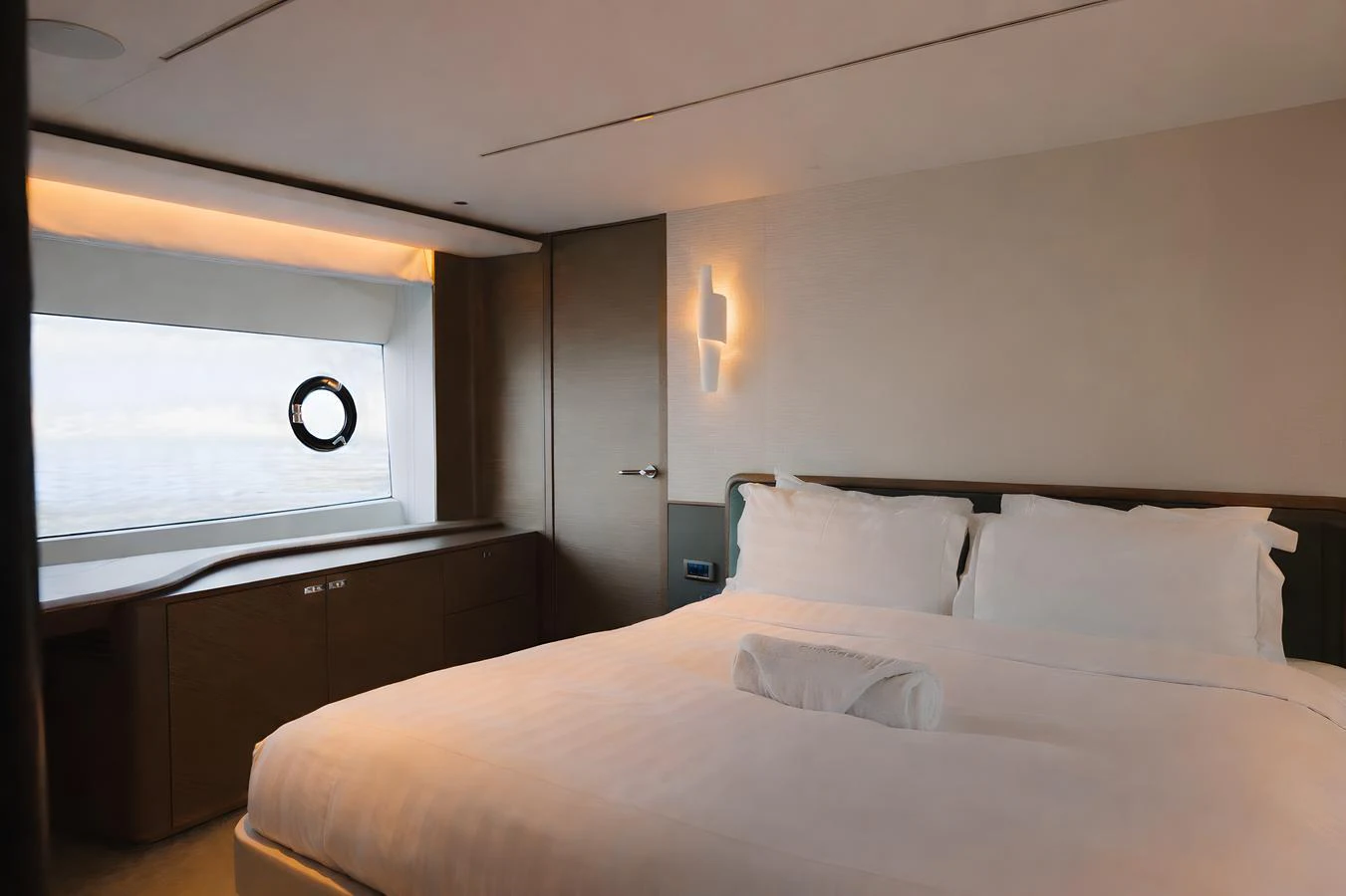 A luxurious stateroom featuring a large bed and a window with an ocean view. aboard PRINCESS X95 808 Yacht for Sale