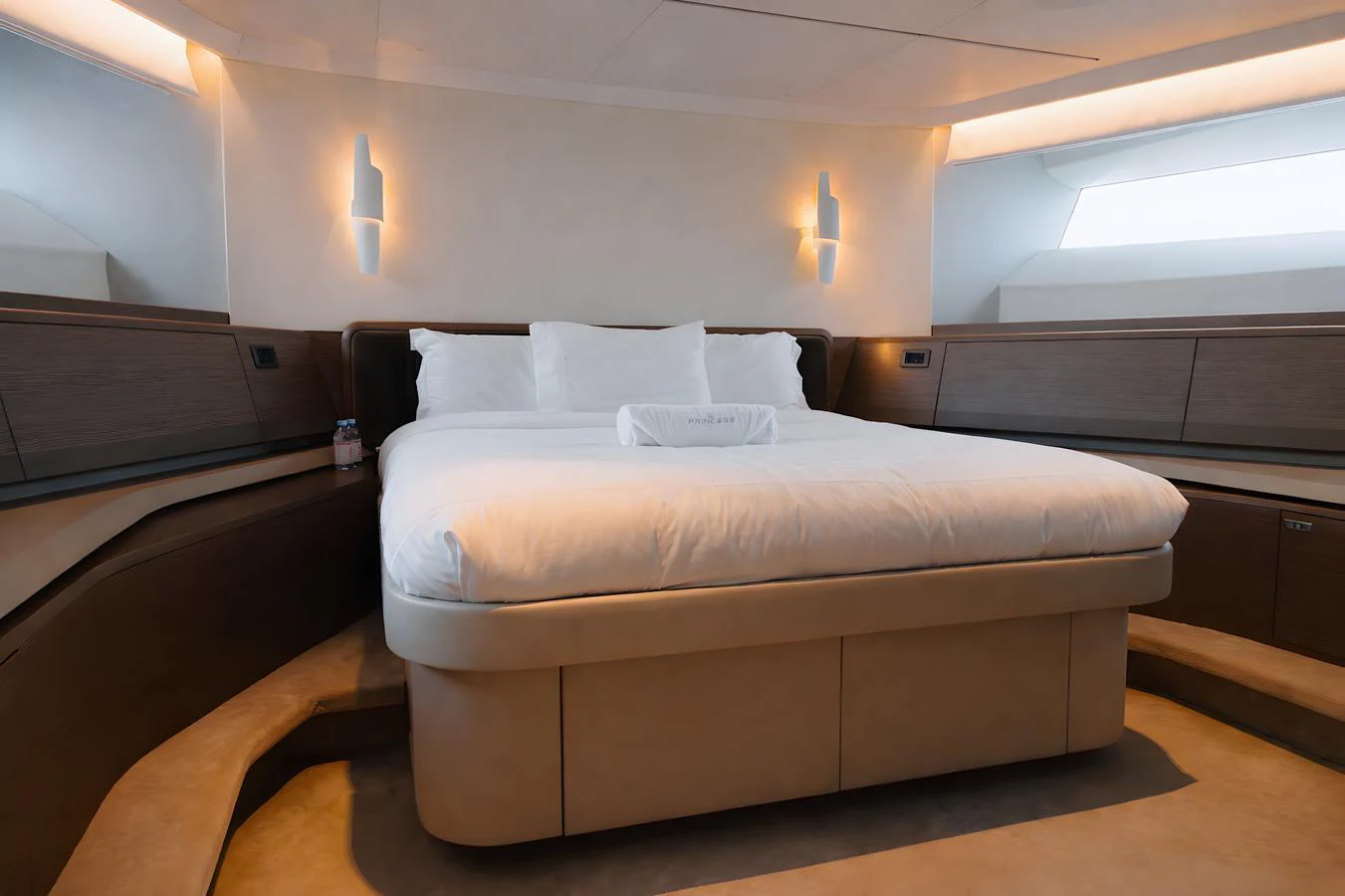 The stateroom features a plush bed with modern lighting and sleek wooden accents. aboard PRINCESS X95 808 Yacht for Sale