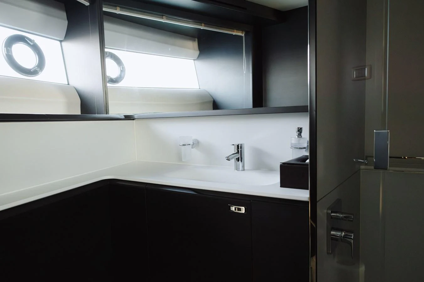 The yacht's bathroom features modern fixtures and a sleek design with ample natural light. aboard PRINCESS X95 808 Yacht for Sale