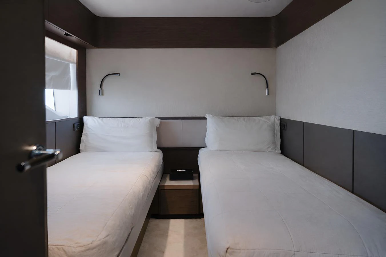 The twin stateroom offers a cozy and private sleeping area with two single beds. aboard PRINCESS X95 808 Yacht for Sale