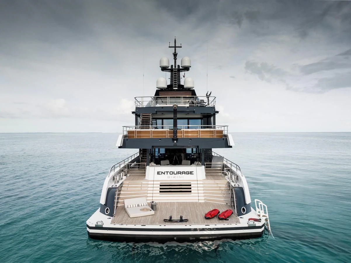 A luxurious yacht with a spacious aft deck, perfect for relaxation and water activities. aboard ENTOURAGE Yacht for Sale