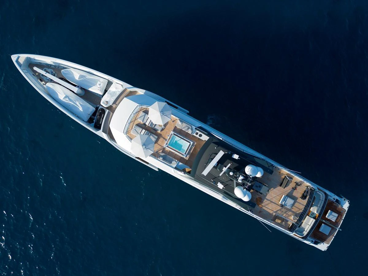 An aerial view of a luxurious yacht showcasing its sleek design and spacious deck areas. aboard ENTOURAGE Yacht for Sale