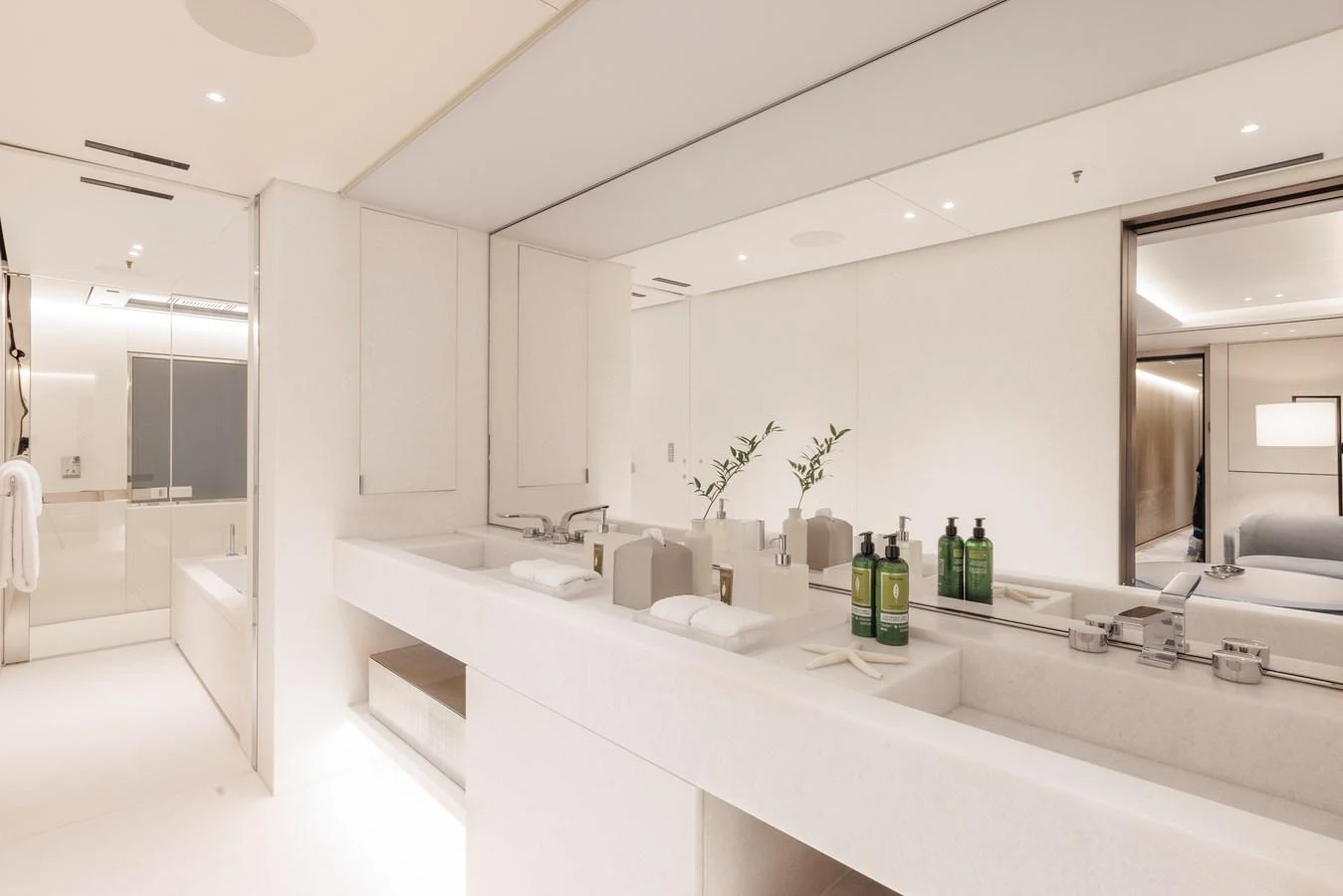 A luxurious and spacious yacht bathroom with modern fixtures and elegant design. aboard ENTOURAGE Yacht for Sale