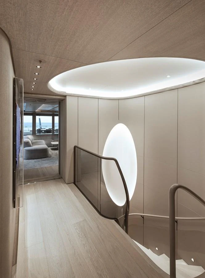 A modern and elegant staircase area with soft lighting and sleek design. aboard ENTOURAGE Yacht for Sale