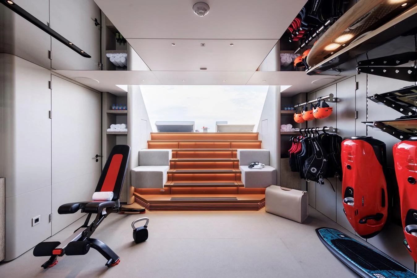 The yacht's gym is equipped with modern fitness equipment and offers a bright, inviting space for workouts. aboard ENTOURAGE Yacht for Sale