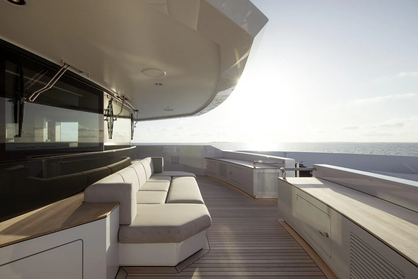 The sundeck offers a luxurious lounging area with panoramic ocean views. aboard ENTOURAGE Yacht for Sale