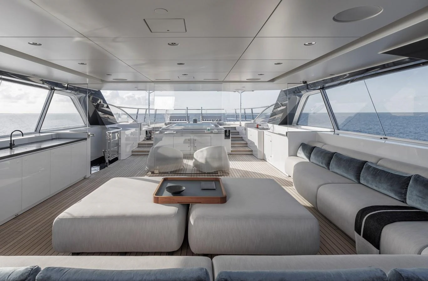 The spacious salon offers panoramic views and luxurious seating arrangements. aboard ENTOURAGE Yacht for Sale