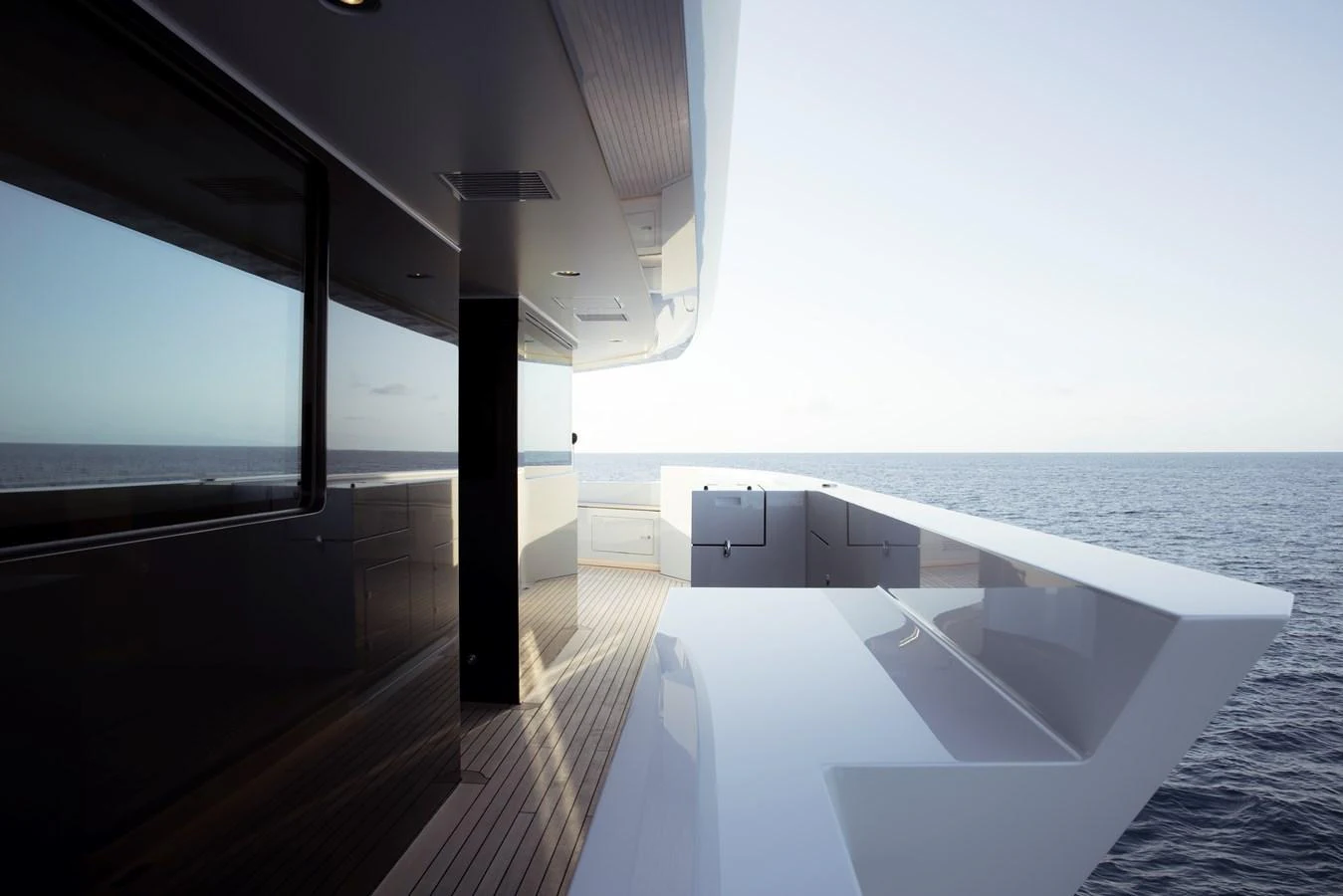 The sleek aft deck offers a serene view of the open sea. aboard ENTOURAGE Yacht for Sale
