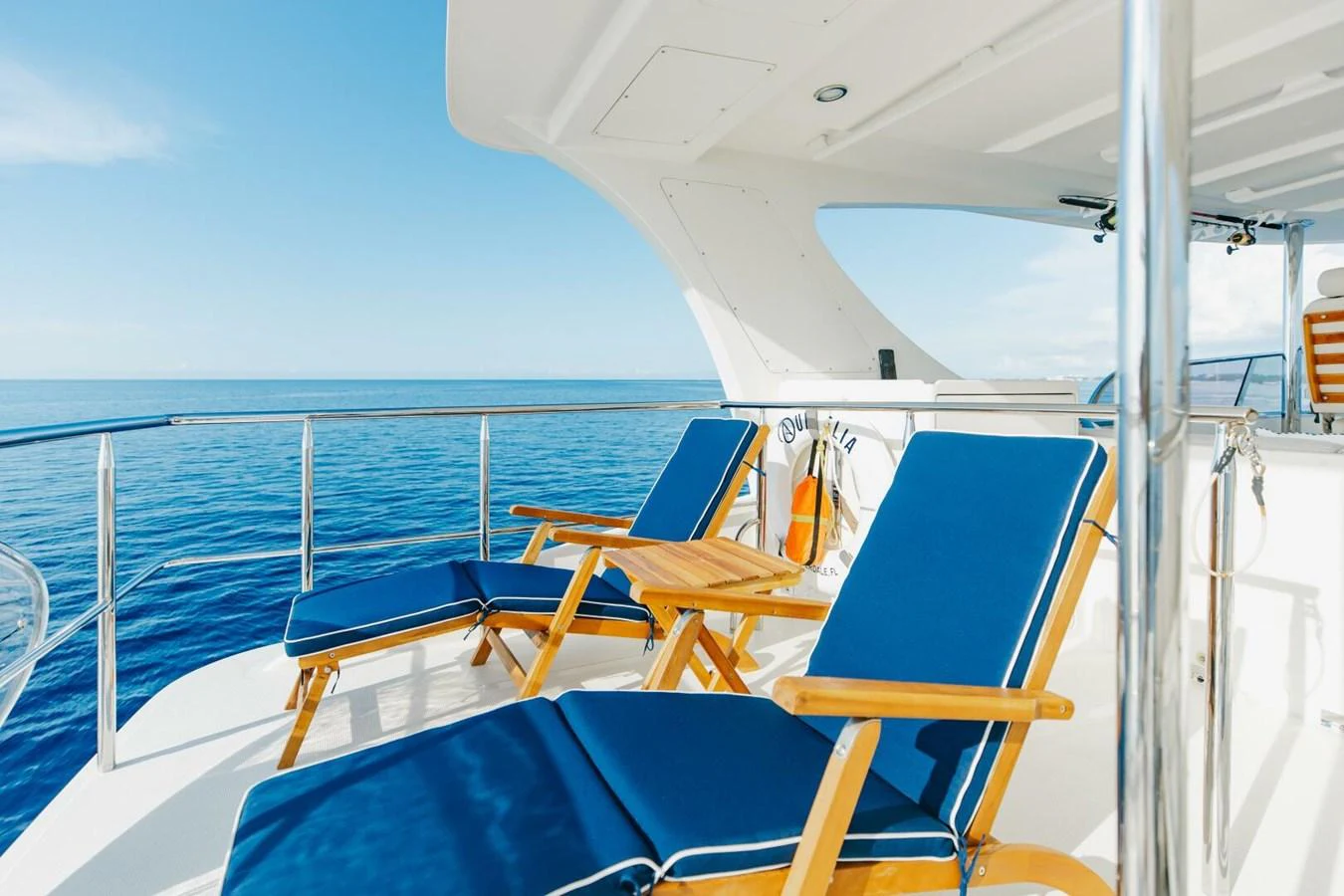 The sundeck offers a serene spot with comfortable lounge chairs and a stunning ocean view. aboard AURELIA Yacht for Sale
