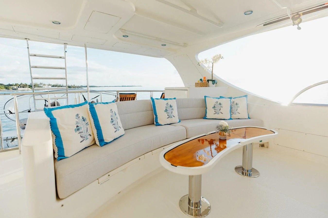 The yacht's salon features a comfortable seating area with elegant decor and a view of the water. aboard AURELIA Yacht for Sale
