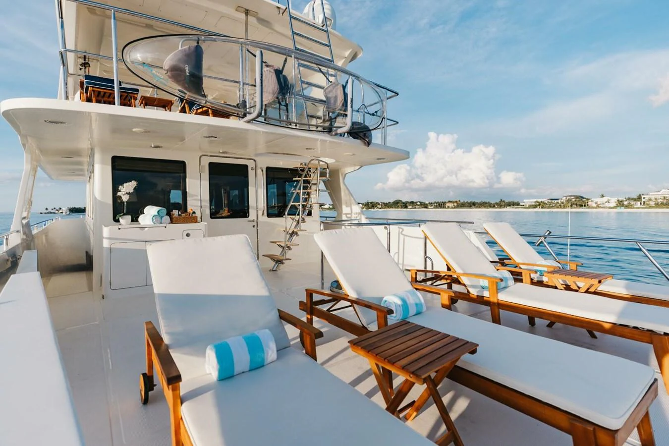 The sundeck features luxurious lounge chairs with a stunning view of the water. aboard AURELIA Yacht for Sale