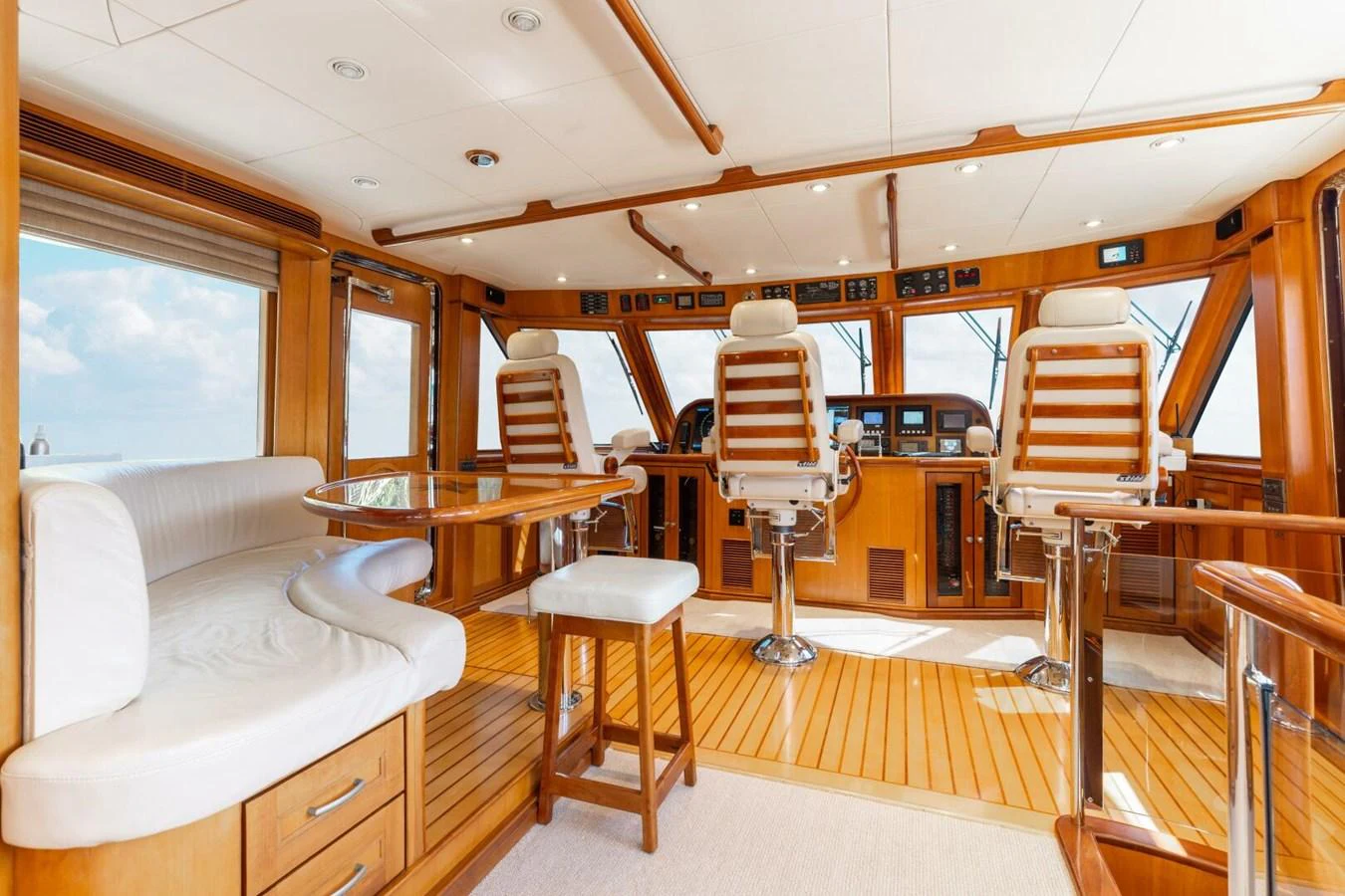 The helm area features luxurious seating and a panoramic view, blending functionality with comfort. aboard AURELIA Yacht for Sale