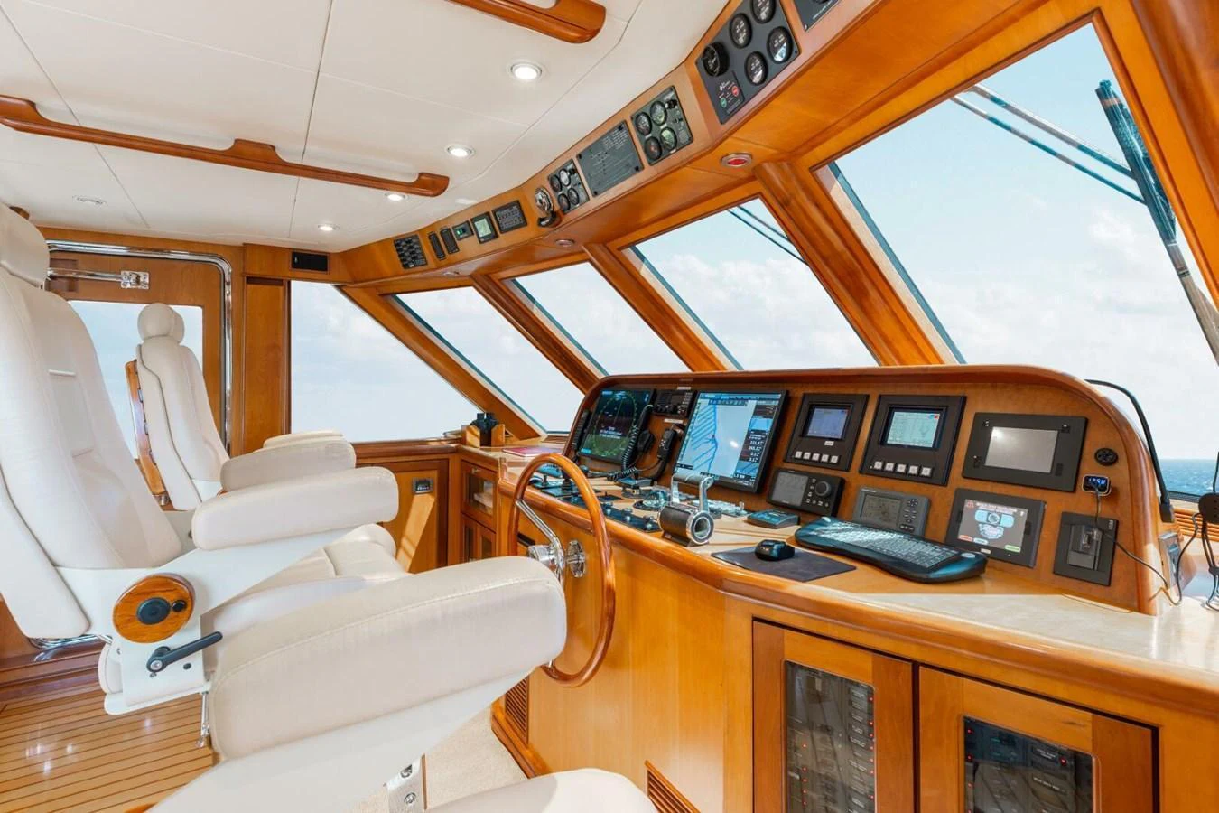 The helm features advanced navigation equipment and luxurious seating. aboard AURELIA Yacht for Sale