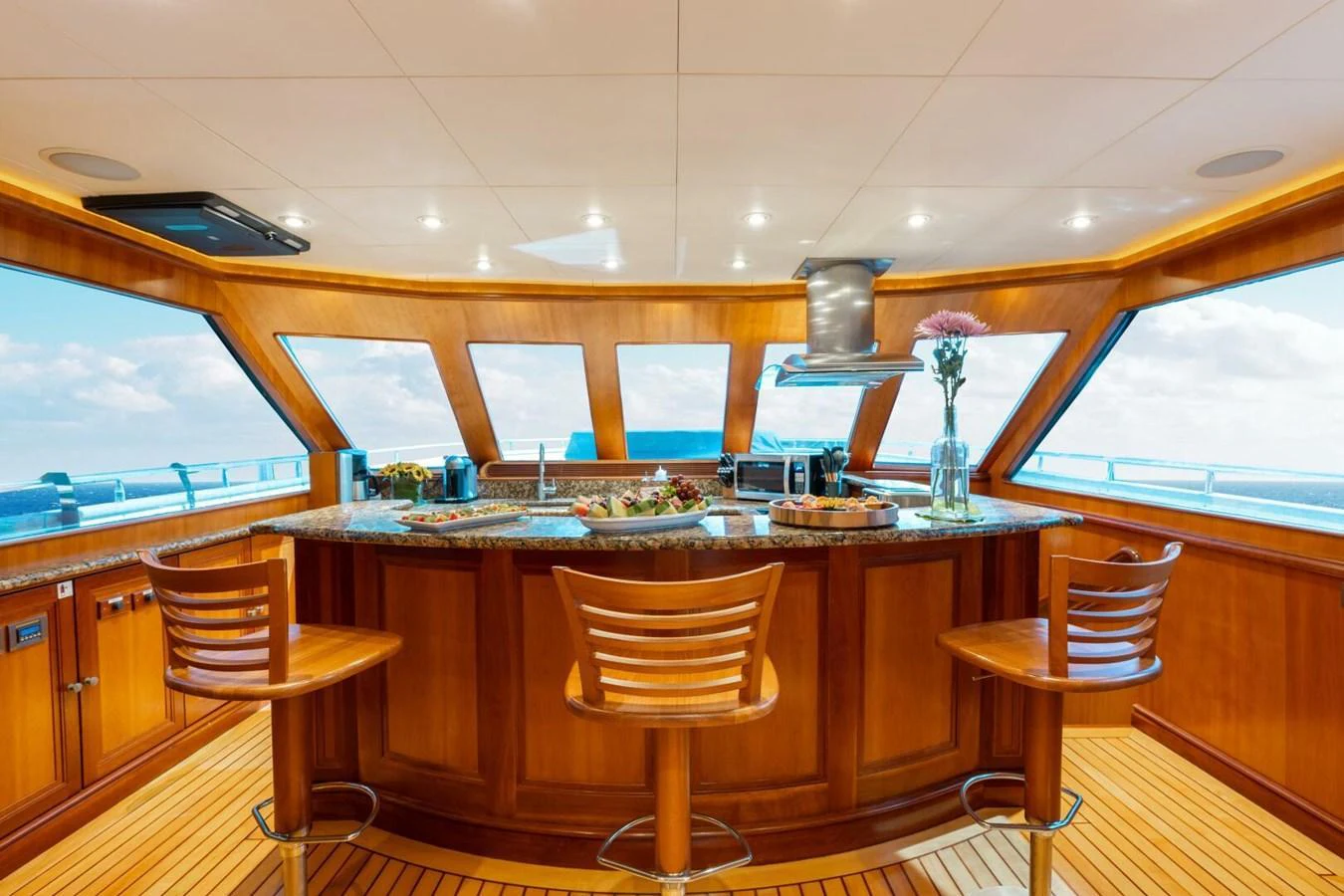 The yacht's galley features a spacious and elegant design with panoramic windows offering stunning ocean views. aboard AURELIA Yacht for Sale