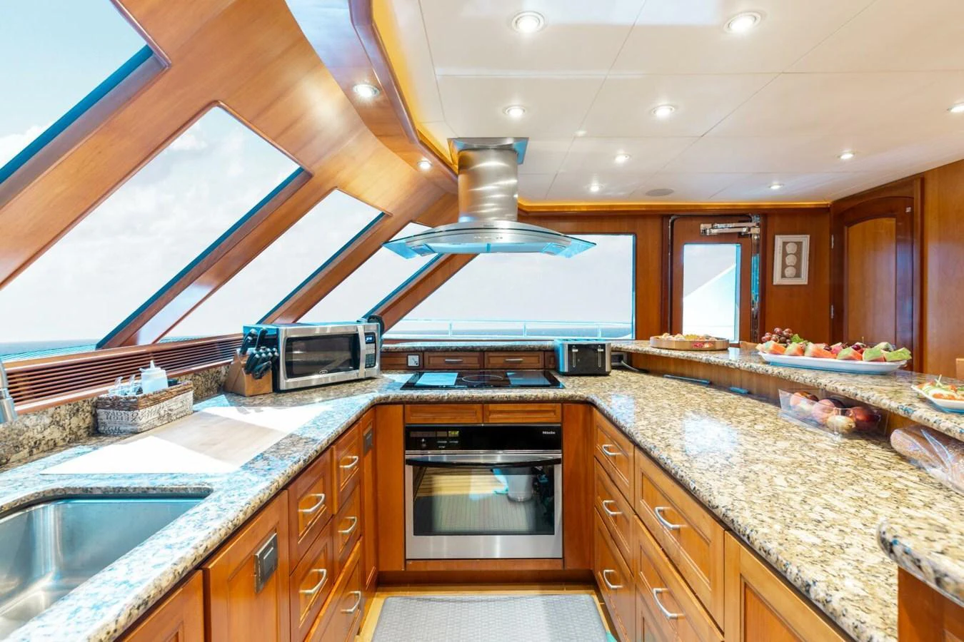 The yacht's galley is equipped with modern appliances and ample counter space, offering a bright and inviting atmosphere. aboard AURELIA Yacht for Sale