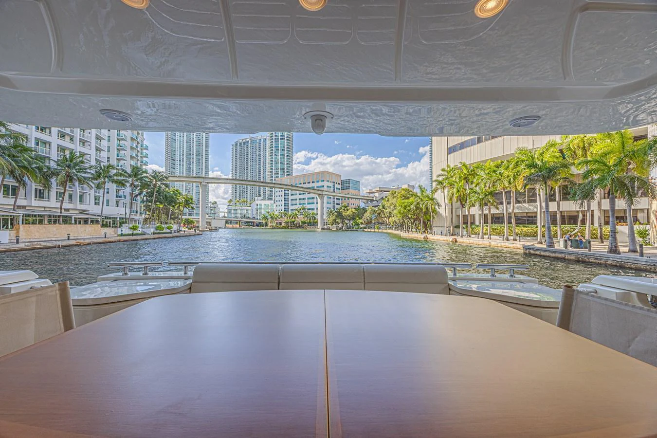 The aft deck offers a serene view of the waterway and cityscape, perfect for alfresco dining. aboard NORAL Yacht for Sale