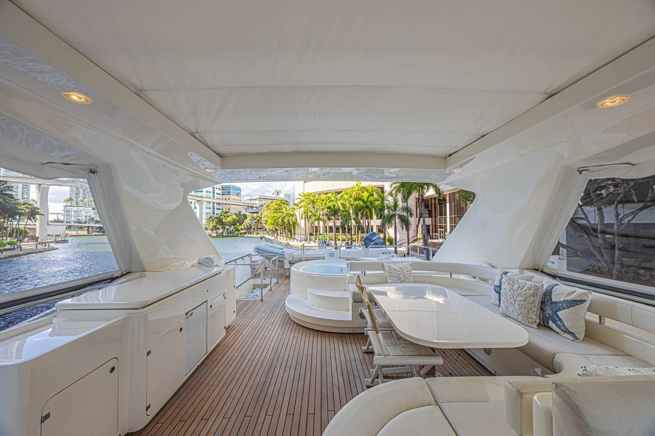 The aft deck offers a spacious and elegant area for relaxation and dining with a view of the water. aboard NORAL Yacht for Sale