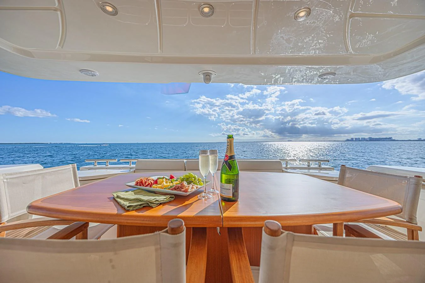 The aft deck offers a stunning dining experience with a view of the open sea. aboard NORAL Yacht for Sale