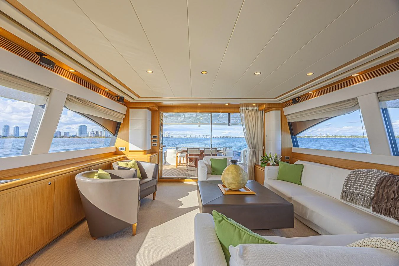 The spacious salon offers panoramic views and luxurious seating. aboard NORAL Yacht for Sale