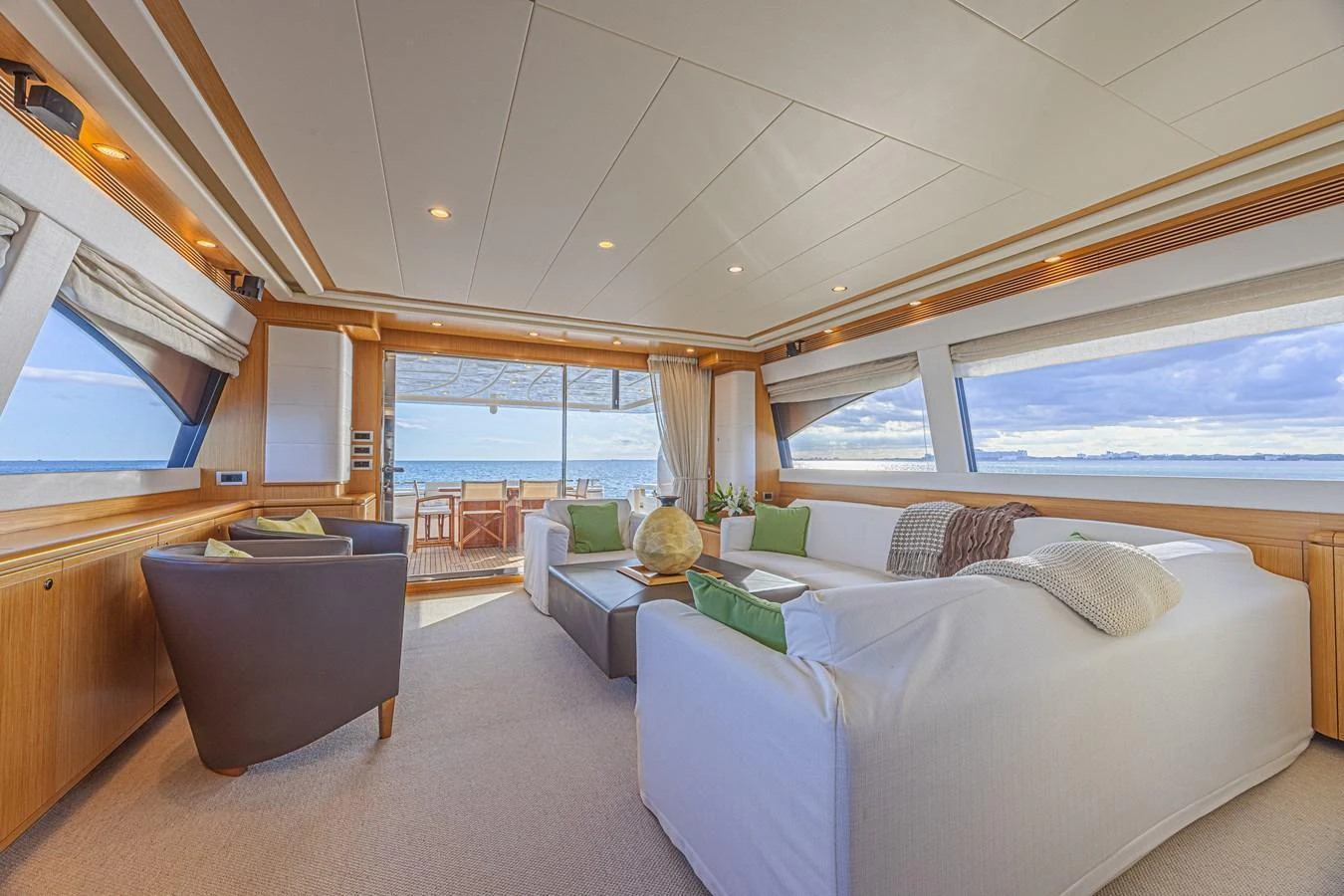 The salon offers a spacious and inviting area with panoramic views and comfortable seating. aboard NORAL Yacht for Sale