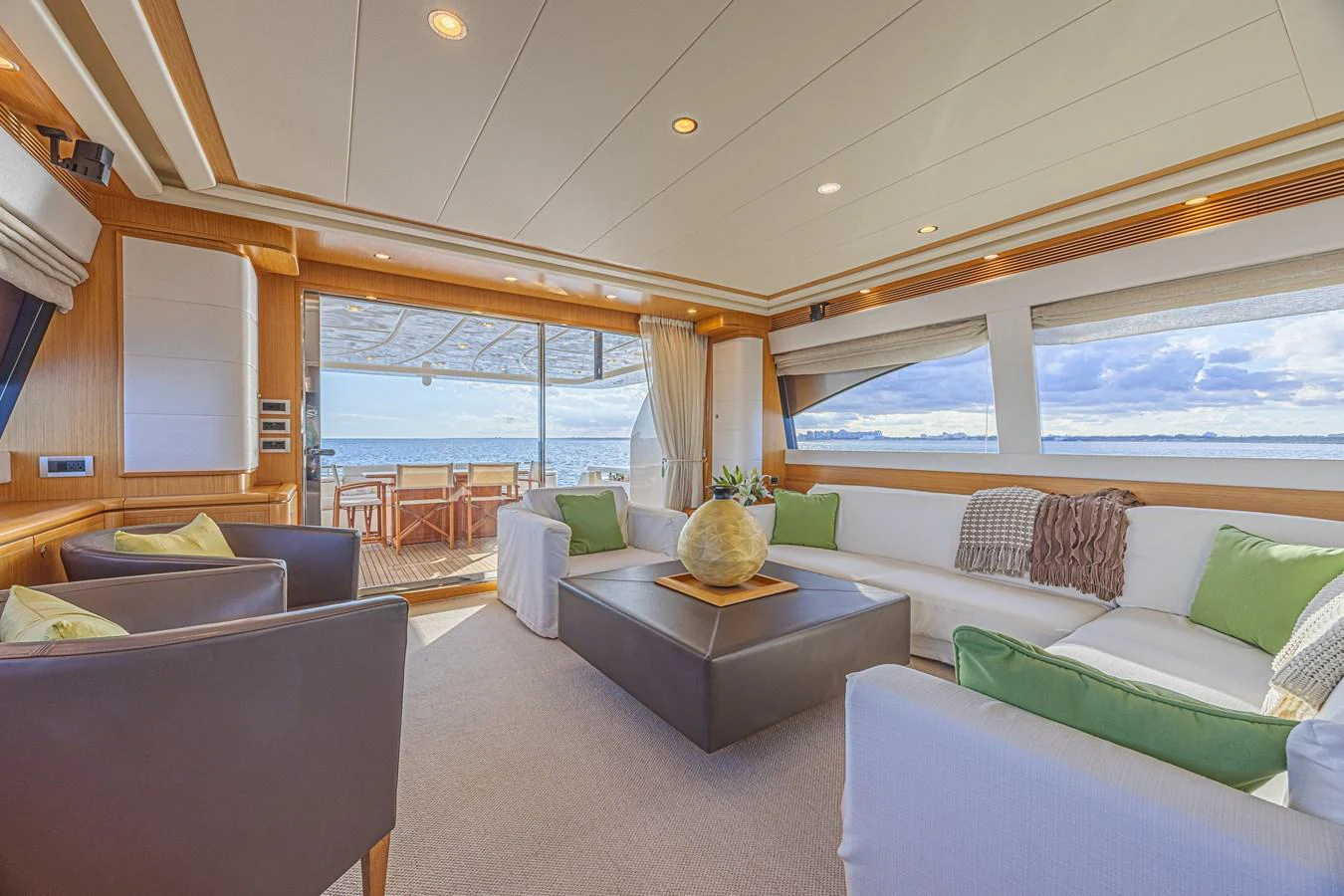 The salon offers a spacious and inviting area with plush seating and panoramic views. aboard NORAL Yacht for Sale