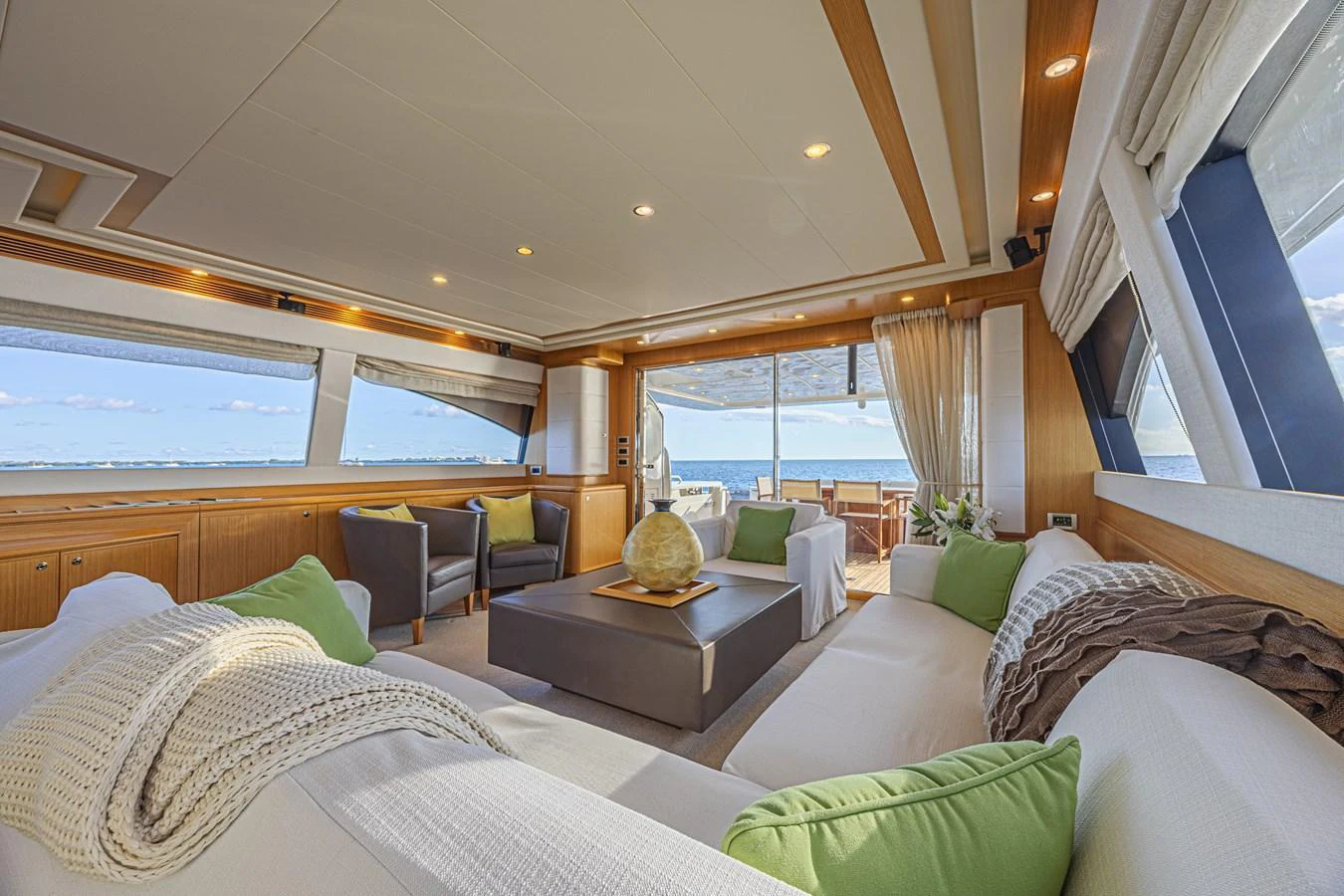 The salon offers a spacious and luxurious seating area with panoramic views and elegant decor. aboard NORAL Yacht for Sale