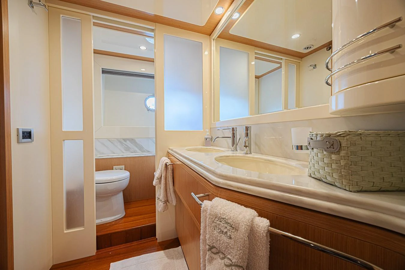 The yacht's bathroom features a sleek design with modern fixtures and ample lighting. aboard NORAL Yacht for Sale