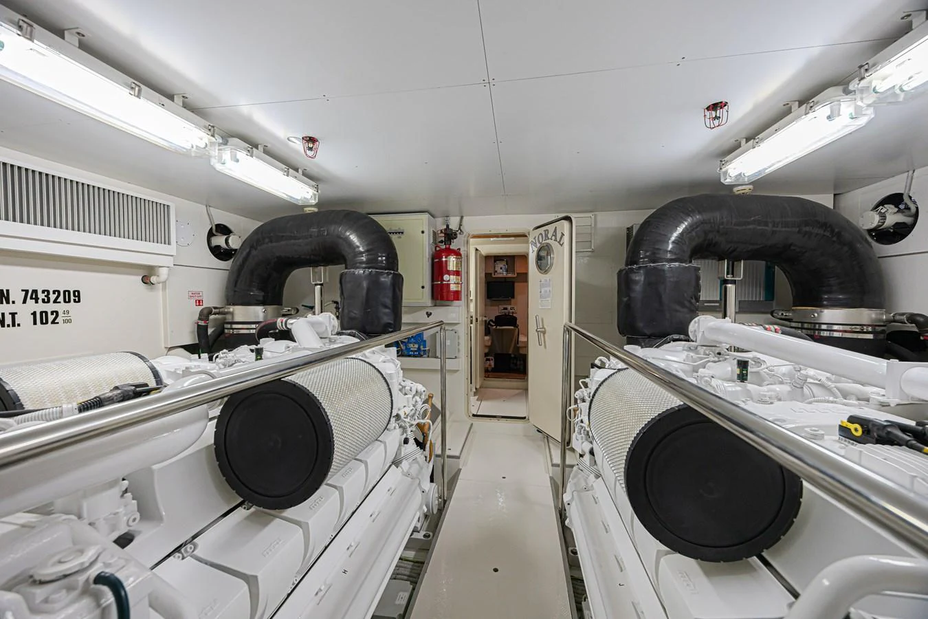 The image showcases the yacht's well-maintained engine room with advanced machinery. aboard NORAL Yacht for Sale