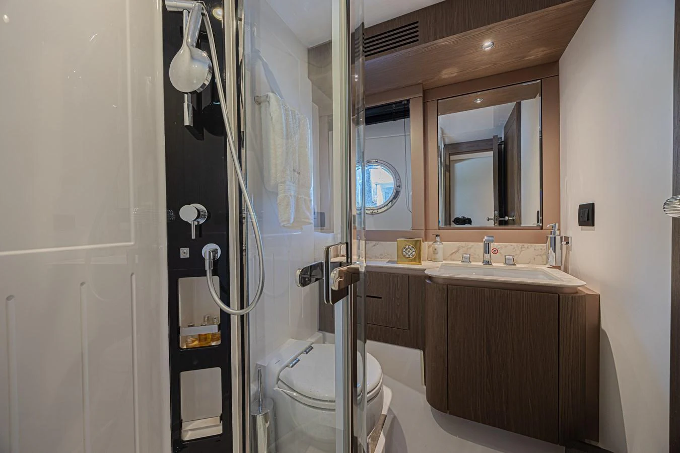 The yacht's bathroom features a modern design with a glass-enclosed shower and sleek fixtures. aboard XAX66M61L122 Yacht for Sale
