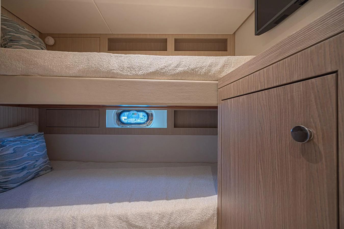 The cozy cabin features comfortable bunk beds and a small window for natural light. aboard XAX66M61L122 Yacht for Sale