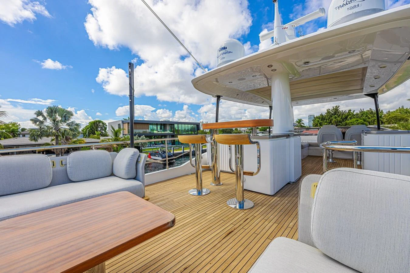 The flybridge offers a spacious and inviting area with comfortable seating and a bar for relaxation and entertainment. aboard XAX66M61L122 Yacht for Sale