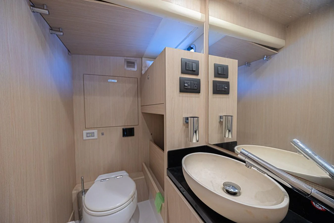 The yacht's head features modern fixtures and a sleek design. aboard XAX66M61L122 Yacht for Sale