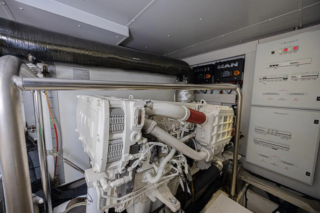 The image showcases the yacht's well-maintained engine room with advanced machinery and control panels. aboard XAX66M61L122 Yacht for Sale