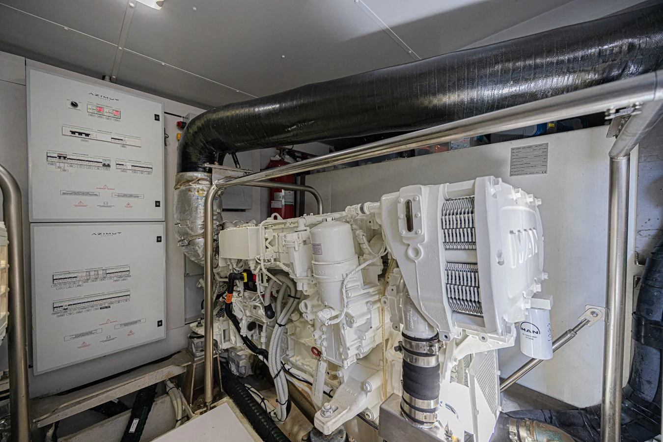 The image showcases the yacht's well-maintained engine room with advanced machinery. aboard XAX66M61L122 Yacht for Sale