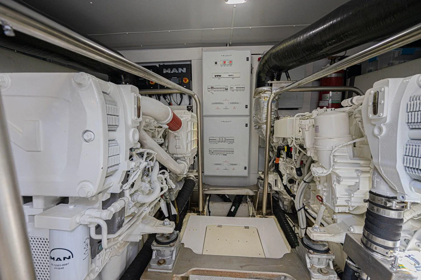 The image showcases the well-maintained engine room of the yacht, featuring advanced machinery and equipment. aboard XAX66M61L122 Yacht for Sale