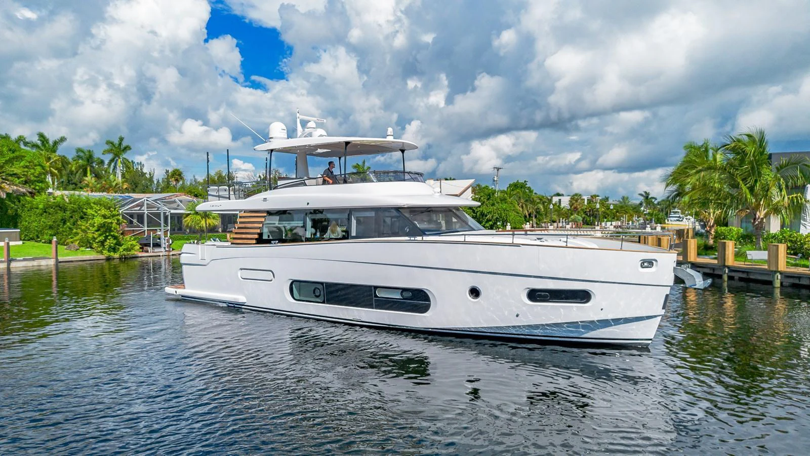 A sleek and modern yacht glides gracefully on calm waters, showcasing its elegant design. aboard XAX66M61L122 Yacht for Sale
