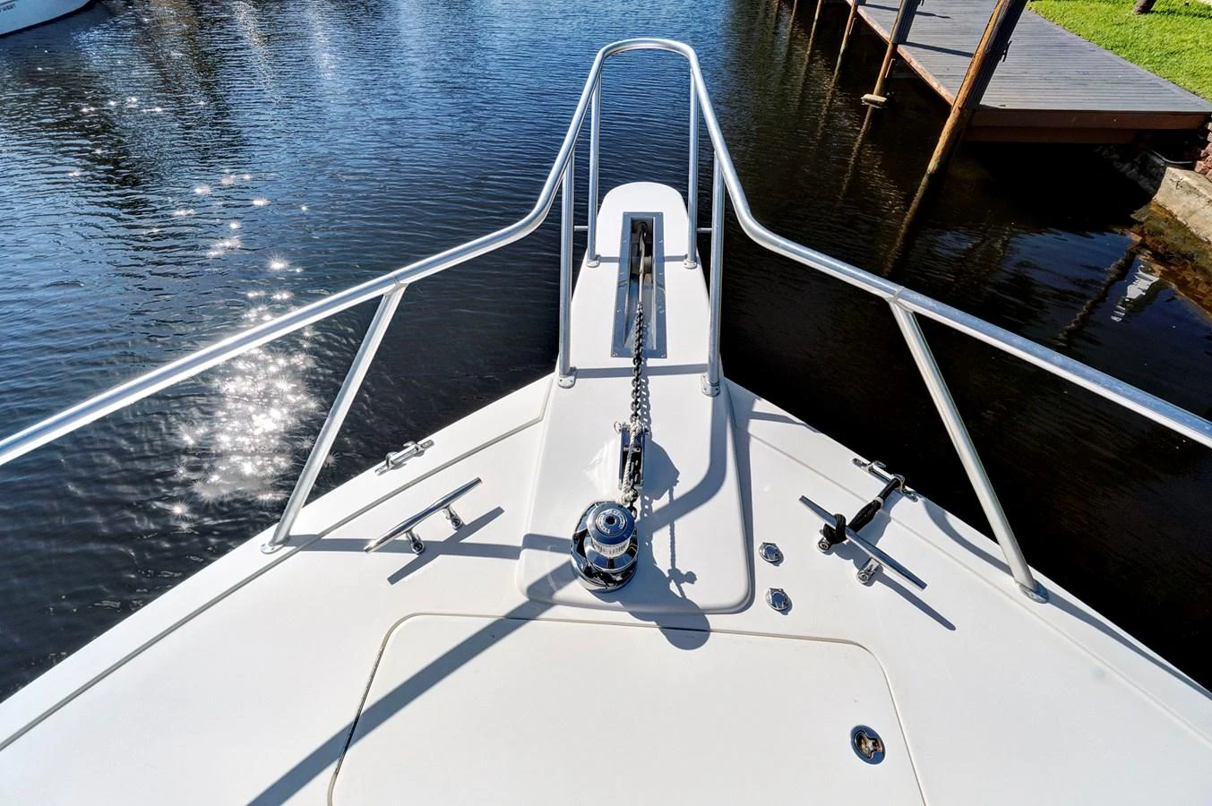 a white boat on a body of water aboard VKY74038A808 Yacht for Sale
