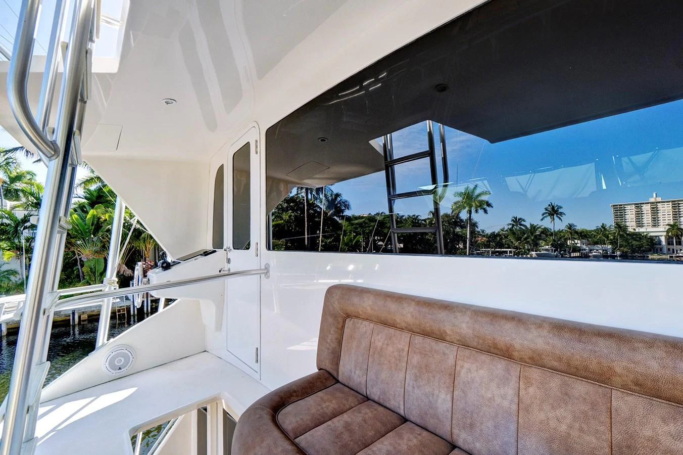 a balcony with a view of the beach and the ocean aboard VKY74038A808 Yacht for Sale