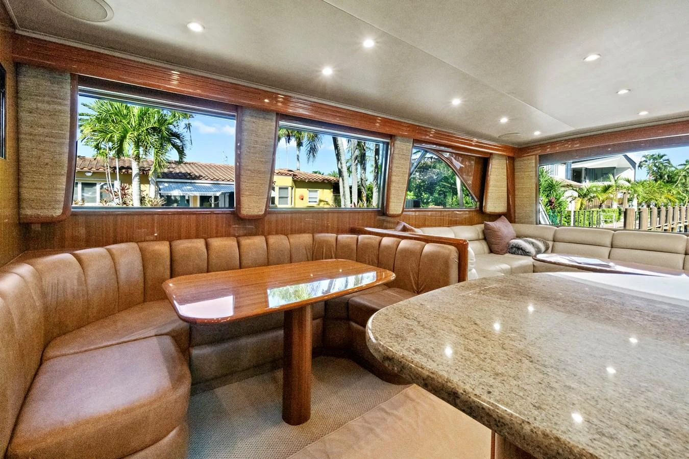 a living room with a table and couches aboard VKY74038A808 Yacht for Sale