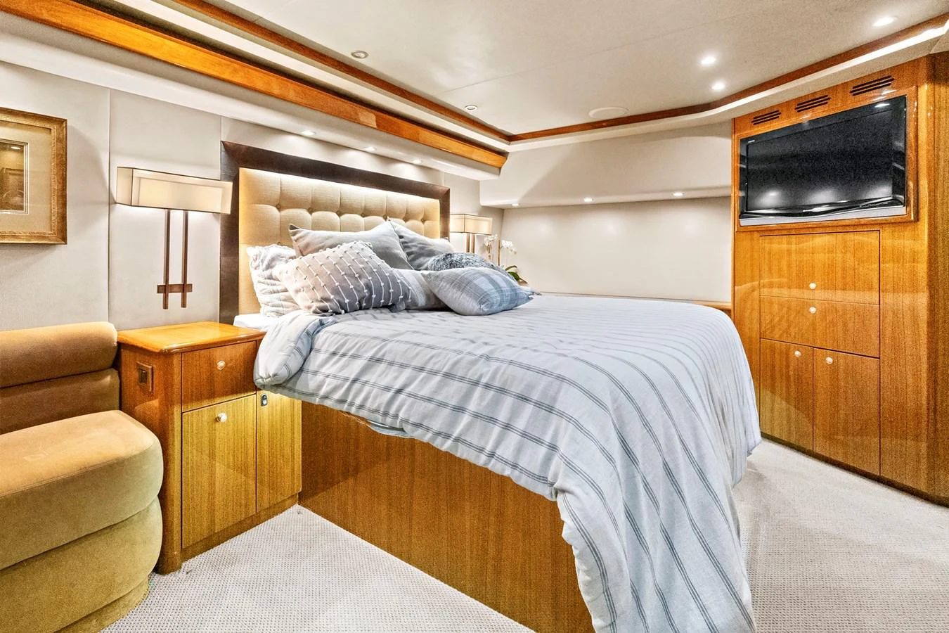 a bedroom with a bed and a chair aboard VKY74038A808 Yacht for Sale