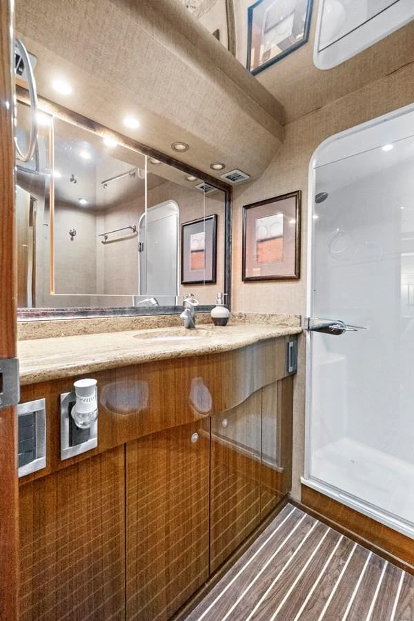 a bathroom with a large mirror aboard VKY74038A808 Yacht for Sale