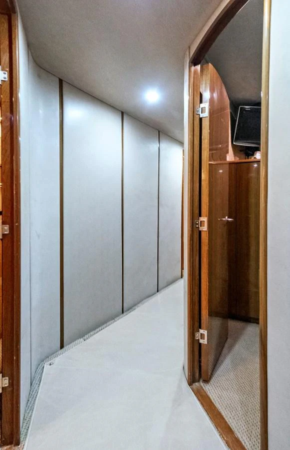 a hallway with a door and a mirror aboard VKY74038A808 Yacht for Sale