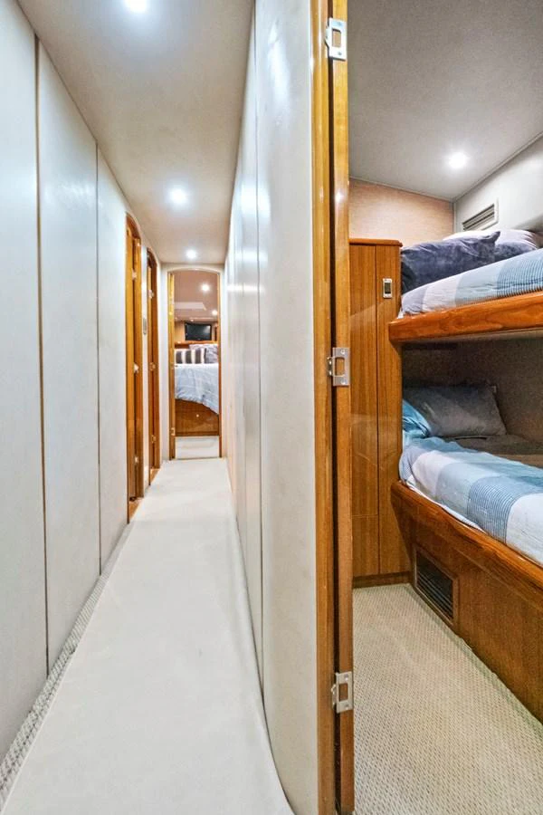 a hallway with a bed and a door aboard VKY74038A808 Yacht for Sale