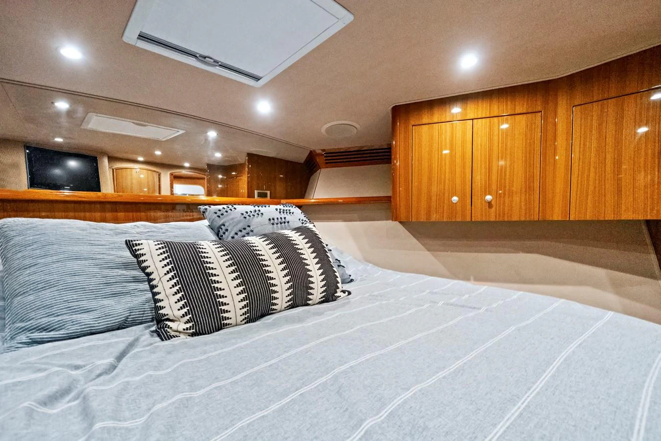 a bed with a white sheet and pillows aboard VKY74038A808 Yacht for Sale