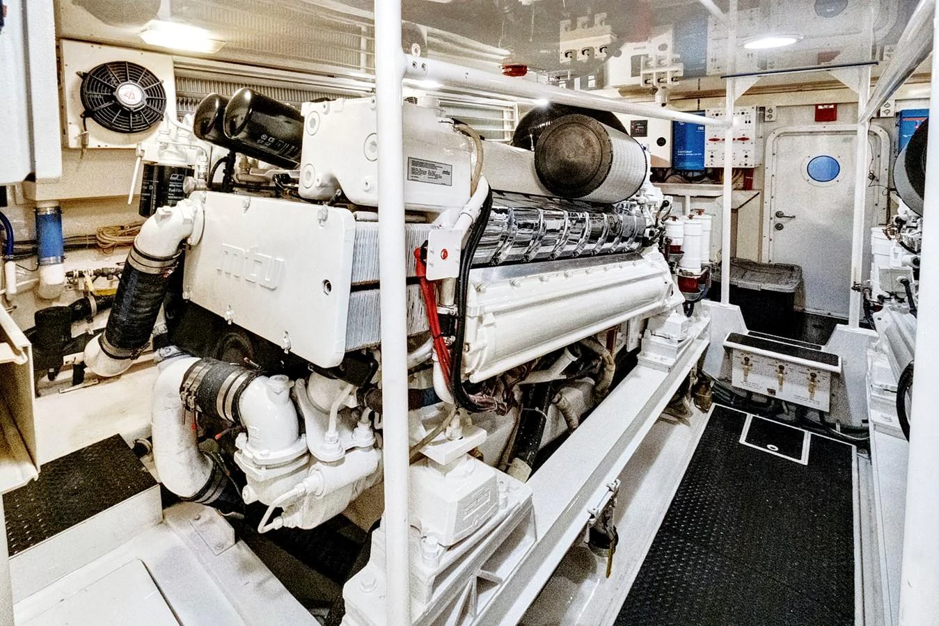 a person in a white suit in a room with machines aboard VKY74038A808 Yacht for Sale