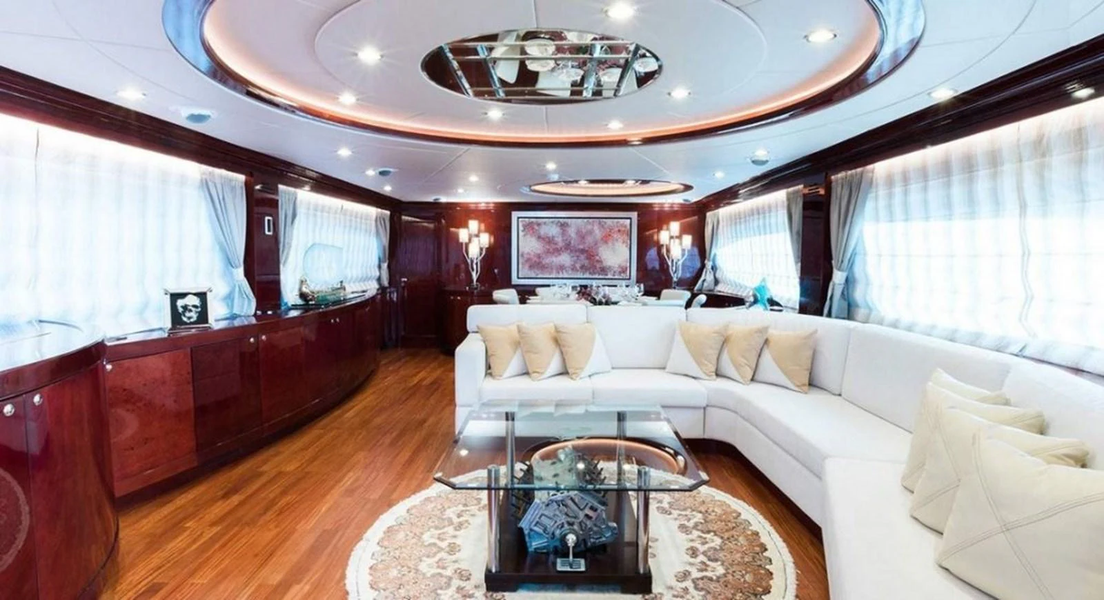 a living room with a large chandelier aboard ALBATOR 2 Yacht for Sale