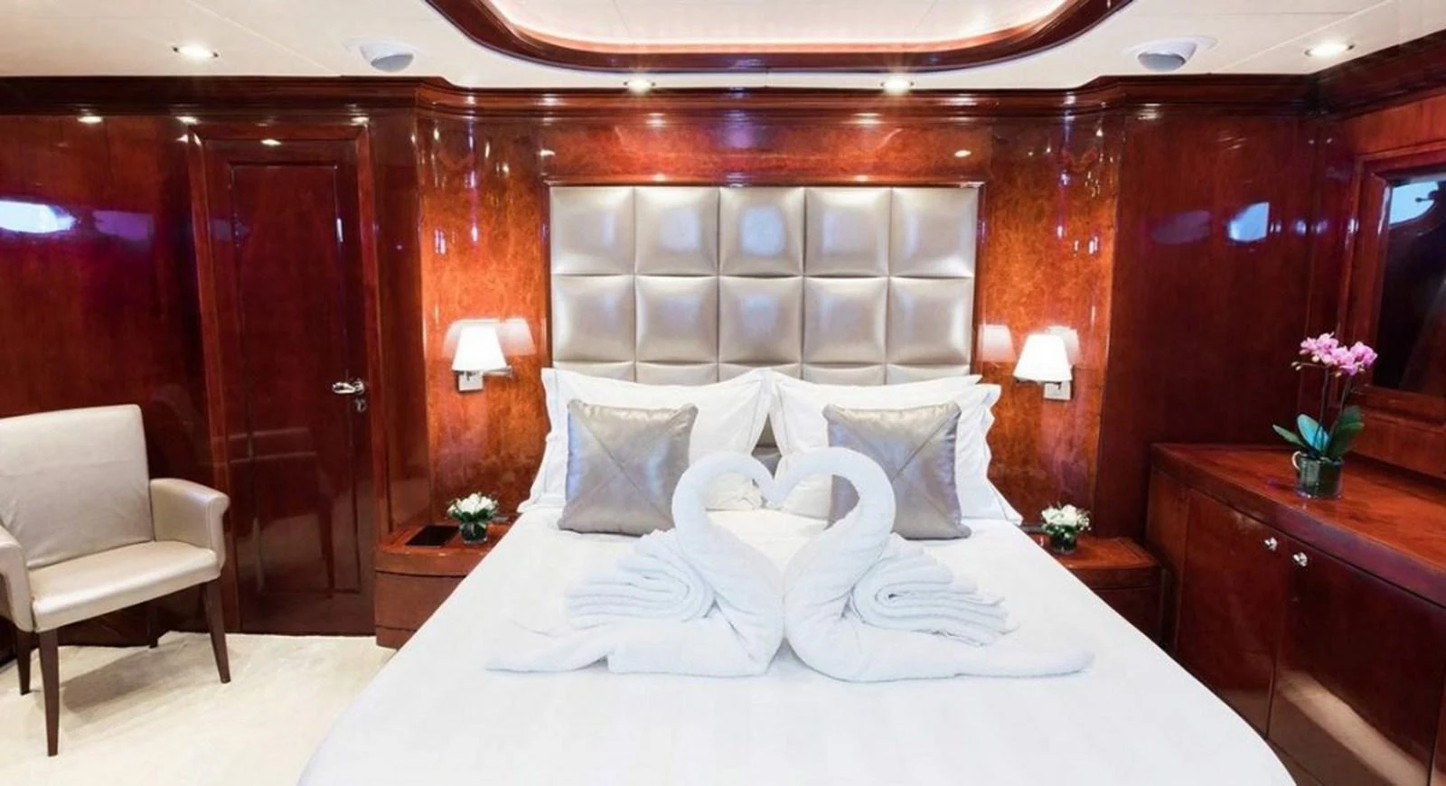 a bed with white sheets and pillows aboard ALBATOR 2 Yacht for Sale