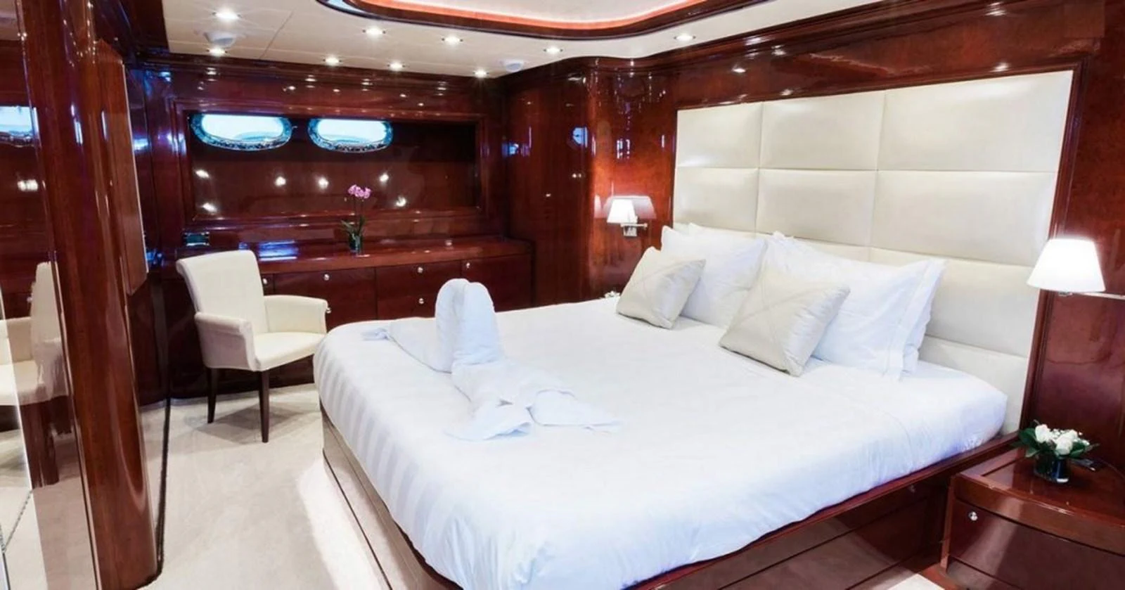 a bed with white sheets and pillows aboard ALBATOR 2 Yacht for Sale